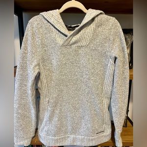 Cozy Sweater in like new condition with front pockets and hood.